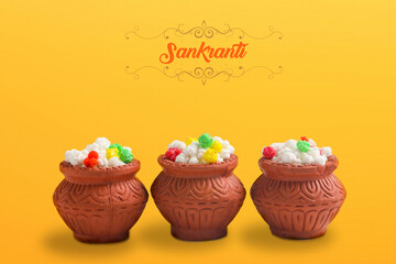 Indian festival makar sankranti concept : Tilgul in small bowl. Tilgul is a colourful sesame candy coated with sesame seeds; in Maharashtra people exchange tilgul on Sankranti