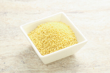 Raw couscous in the bowl