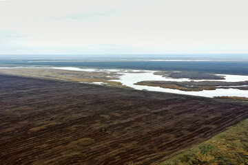 lake in the steppe autumn landscape with clouds