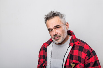 Obraz premium Portrait of a man in a warm buffalo check lumberjack shirt