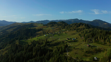 Fototapeta na wymiar Mountain rural land aerial view with amazing blue cloudless sky rocky hills
