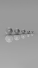 Five balls of metal of different sizes of silver color on gray background. Growth of something. Progress. Reflection. Vertical image. 3D image. 3D rendering.