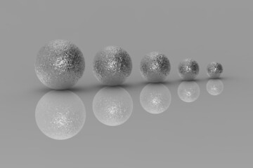 Five balls of metal of different sizes of silver color on gray background. Growth of something. Progress. Reflection. Horizontal image. 3D image. 3D rendering.