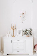 New Year's decor with candles and spruce branches
