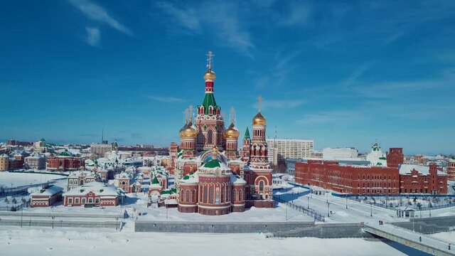 4K Aerial Footage View to the Blessed Virgin Mary Church on the Republic Square from the Bruges Embankment, Mari El Republic, Russia