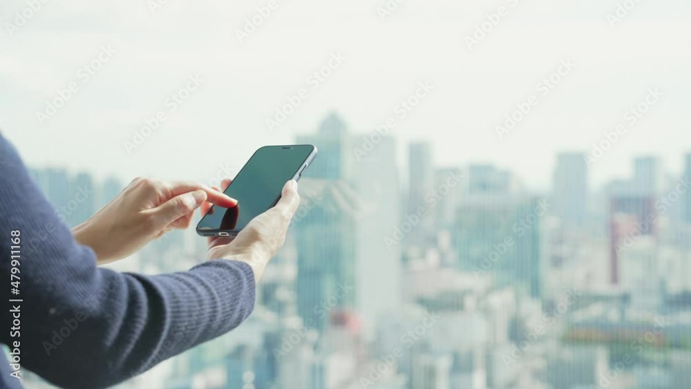 Poster people using a smart phone in front of the city.
