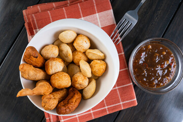 a bowl of kikiam, fish ball and squid ball with sweet chili soy sauce