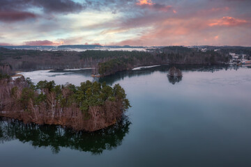 Aerial landscape of a wintery lake at sunset. Poland