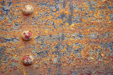 Rusty metal texture with bolts. Background of old vintage steel structure with rivets