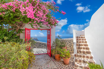 Fantastic travel background, Santorini urban landscape. Red door or gate with stairs and white...