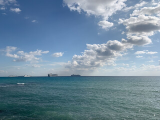 Fototapeta na wymiar Silhouettes of the ships on the sea horizon