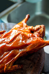 Close-up of whole golden tempting Cantonese roast duck
