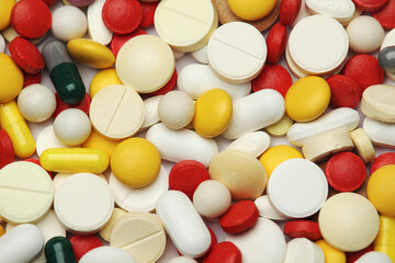 Different colorful tablets at white background