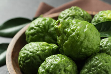 Fresh ripe bergamot fruits in bowl, closeup
