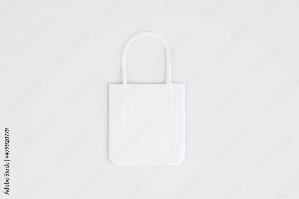 Poster Empty white shopping bag on light background with mock up place. Purchase and commerce concept. 3D Rendering.