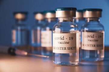 COVID-19 booster vaccine vial. Medicine and health care concept