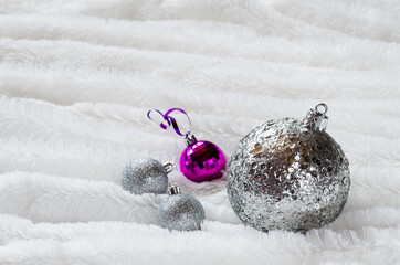 Christmas balls on white fur