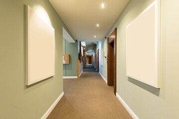 Interior of a long corridor with mock up for paintings, blank frame