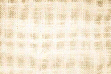 Jute hessian sackcloth burlap canvas woven texture background pattern in light beige cream brown color blank. Natural weaving fiber linen and cotton cloth texture as clean empty for decoration.