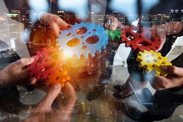 Business team connect pieces of gears as teamwork and partner