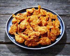 Crispy Fried Butterfly Shrimp on a grey plate