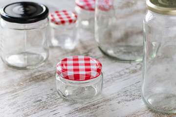 Empty glass jars of different sizes and shapes