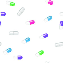 Multi-colored pills capsules on a white background. Pattern.
