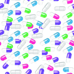 Multi-colored pills capsules on a white background. Pattern.