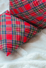Red tartan pillows in interior decoration