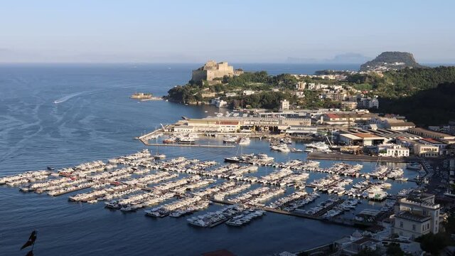 beautiful view of the port of Baia in the Campi Flegrei with Vesuvius, Capri island and Sorrento peninsula in the background. Phlegraean Fields, Naples, Campania, Italy