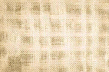 Jute hessian sackcloth burlap canvas woven texture background pattern in light beige cream brown color blank. Natural weaving fiber linen and cotton cloth texture as clean empty for decoration.