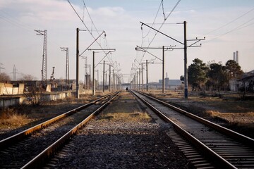 Fototapeta na wymiar Evening scene with a railway. Railway going to infinity.