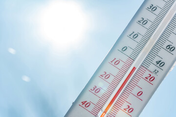 Thermometer in winter in the cold on snow and analyzes low negative air temperatures in clear sunny weather.Meteorological conditions and environmental analysis.Climate change on earth.Northern region