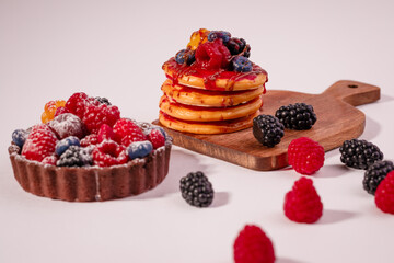 Fresh cake with raspberries in powdered sugar. Dessert in a cafe for breakfast.