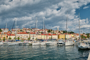 boats in the harbor of losinj