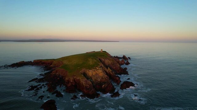 Capel Island in county Cork, Ireland, at sunset on a calm winter day