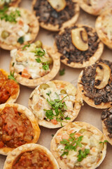 various snacks in tartlets close-up