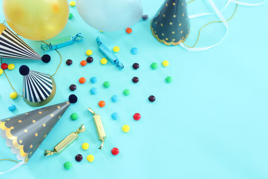 Party colorful image over blue background . Top view, flat lay
