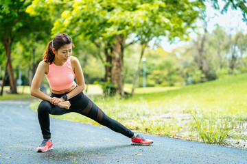 asian young woman stretching in park, lifestyle and health concept.