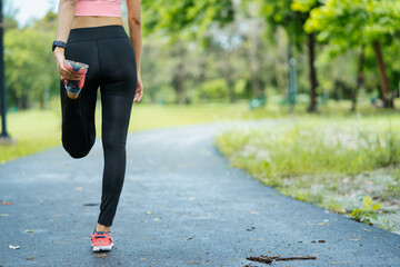 asian young woman stretching in park, lifestyle and health concept.