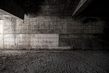 Fototapeta na wymiar concrete walls in an abandoned or unfinished architectural space