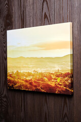 Canvas photo print hanging on wooden wall