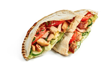 Pita with chicken and cheese, fresh vegetables and red sauce on a white plate. Photo for the menu. Isolated