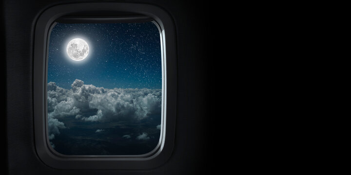 view from the airplane window on the night sky