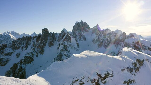Amazing aerial view of mountains in winter with snow and in a sunny day.