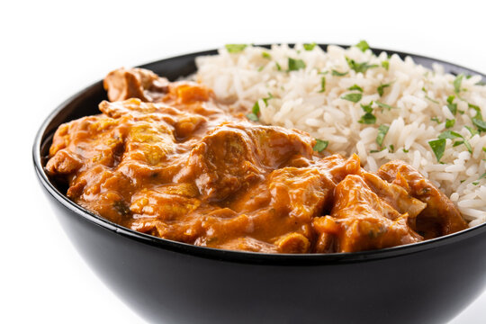 Indian Butter Chicken In Black Bowl Isolated On White Background. Close Up