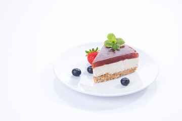 Piece of cheesecake isolated on white background with copyspace.