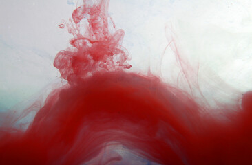 red paint on a white background