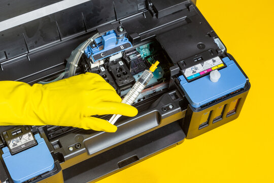 reactivate dried printer cartridges with cleaner and a syringe