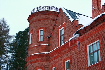 Red brick castle with white painted seams.